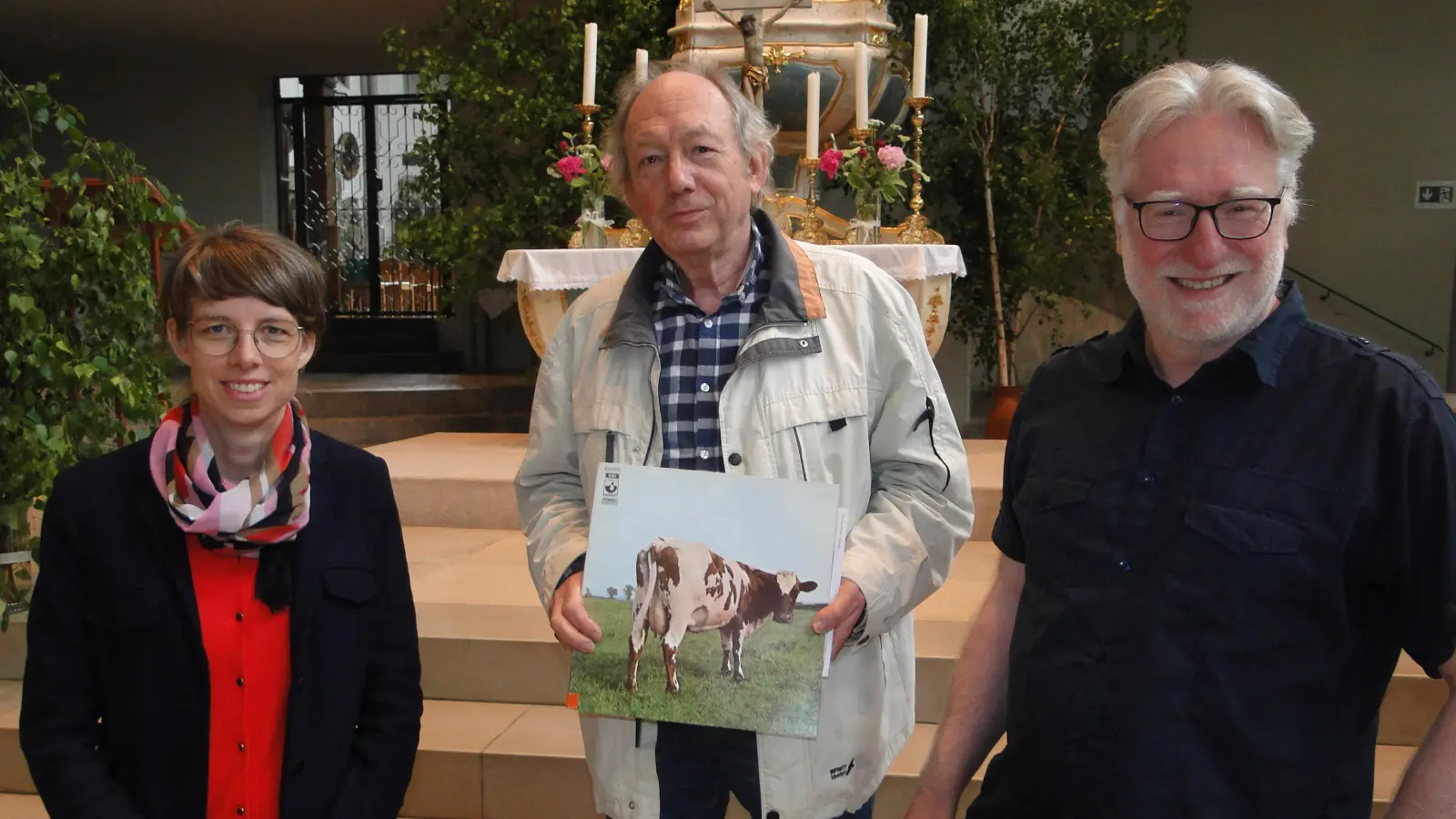 In der Gumbertuskirche wollen Nadja Wilhelm, Richard Illig und Carl Friedrich Meyer (von links) mit rund 80 Musikern und Sängern die „Atom Heart Mother“-Suite von Pink Floyd aufführen.  (Foto: Winfrid Vennemann)